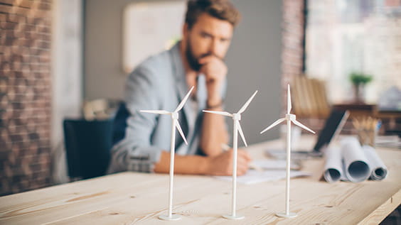 3 mock-ups of a wind turbine on a table