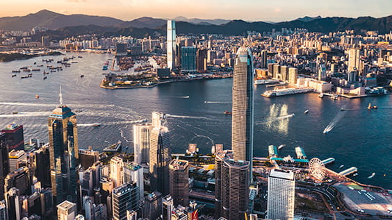 Victoria harbour of Hong Kong at sunset.